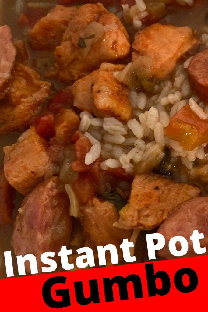 A enlarged photo of chicken and sausage gumbo mixed with rice.