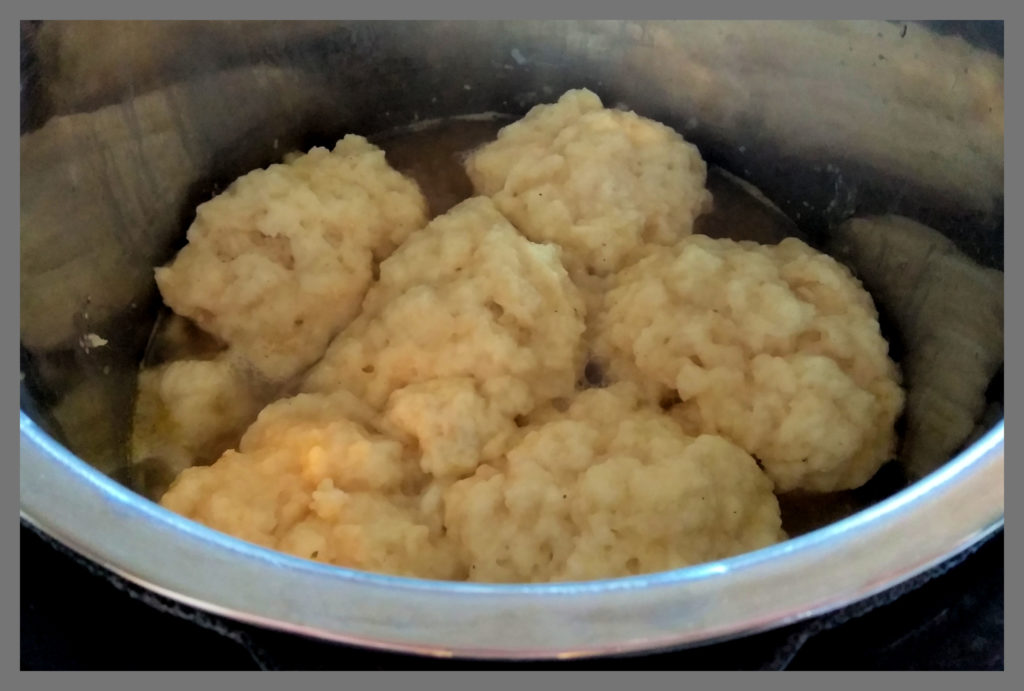 A silver Instant Pot filled with Chicken and Dumplings