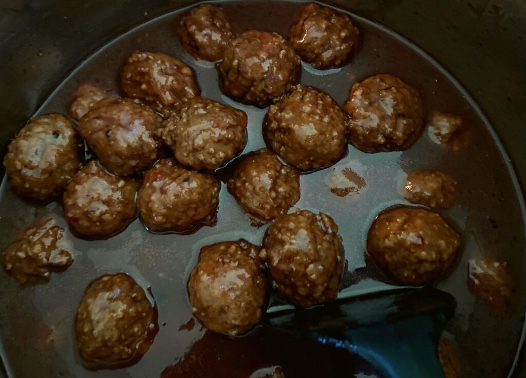 A Instant Pot filled with bbq meatballs.