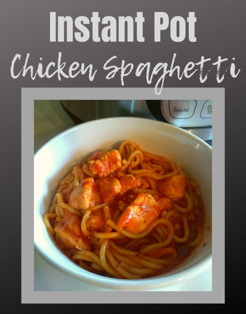 A white bowl filled with chicken spaghetti and a corner of an Instant Pot in the background.