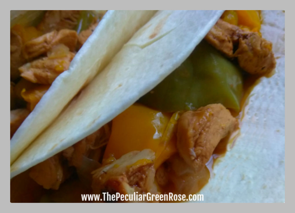 Chicken fajita with green and yellow bell peppers.