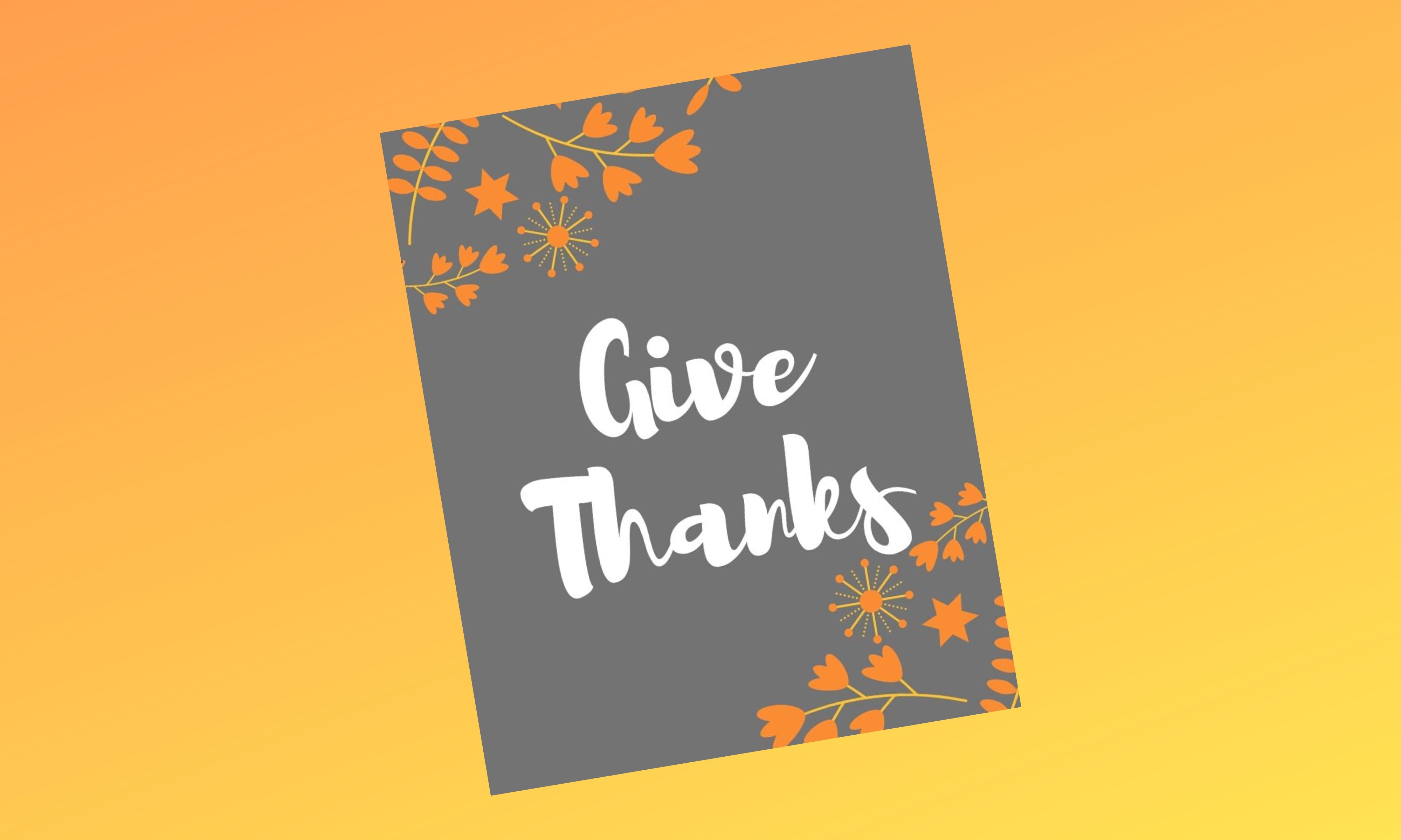 A grey picture that says Give Thanks in white bubble letters and small yellow/orange flower designs on the corners.