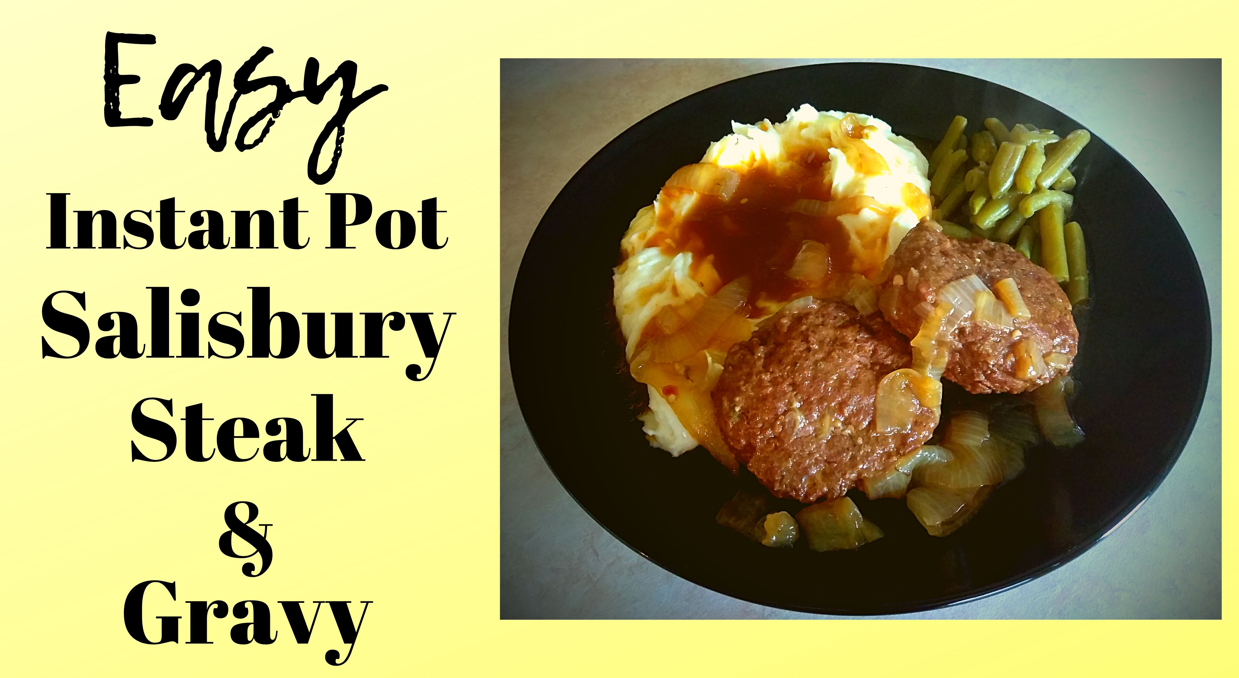 A black plate filled with salisbury steak, mashed potatoes, gravy, onions, and green beans.