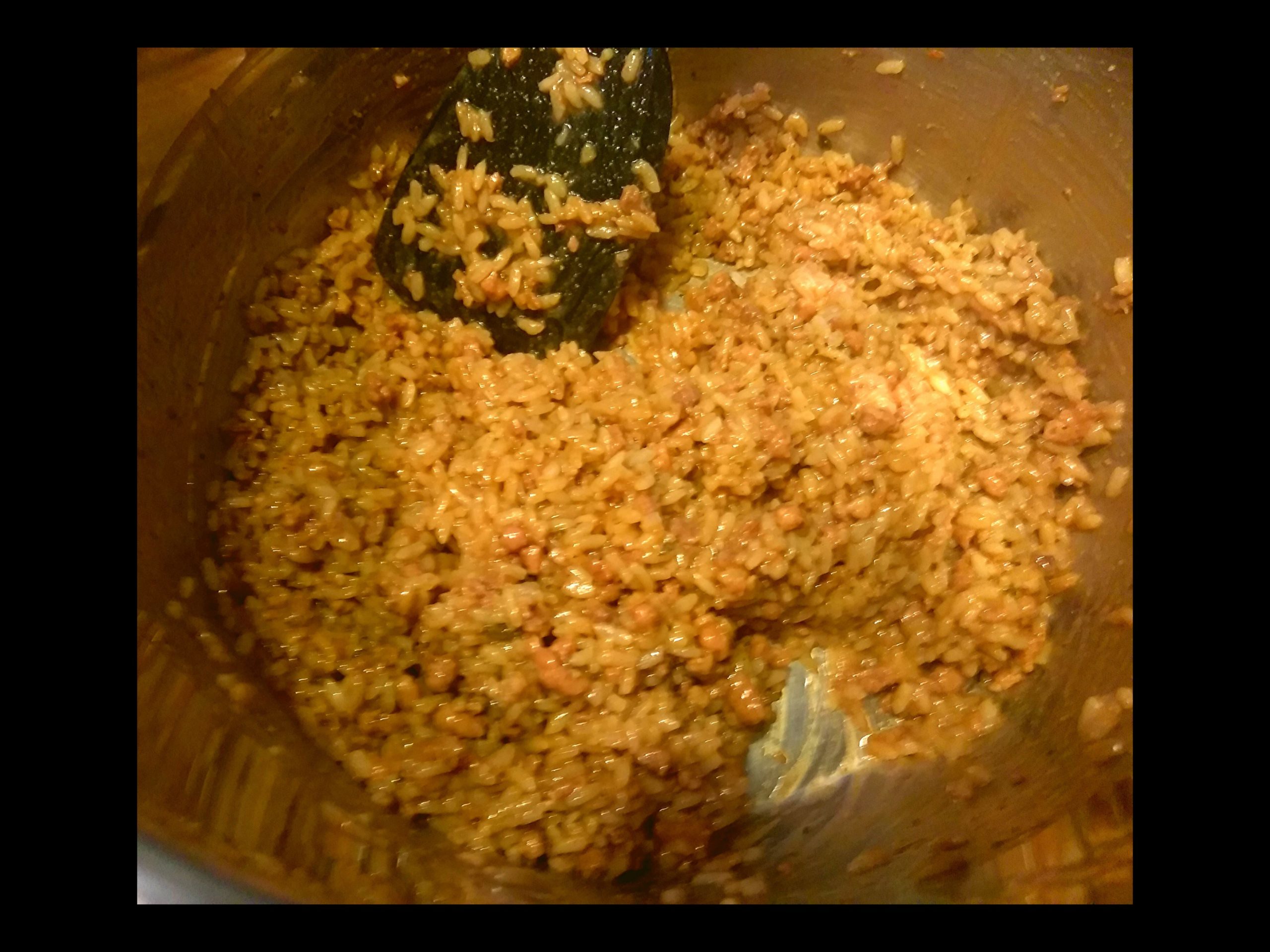 The inside of an Instant Pot filled with Cajun Rice Dressing.