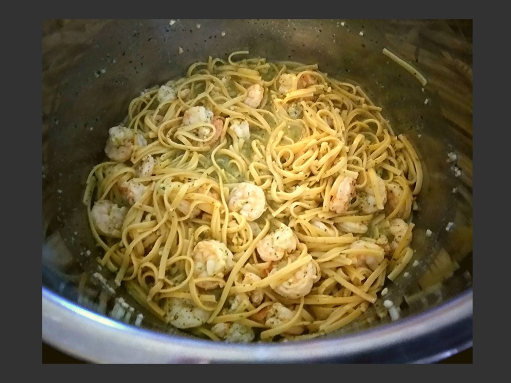 Cooked garlic butter shrimp scampi with linguine noodles inside of an Instant Pot.