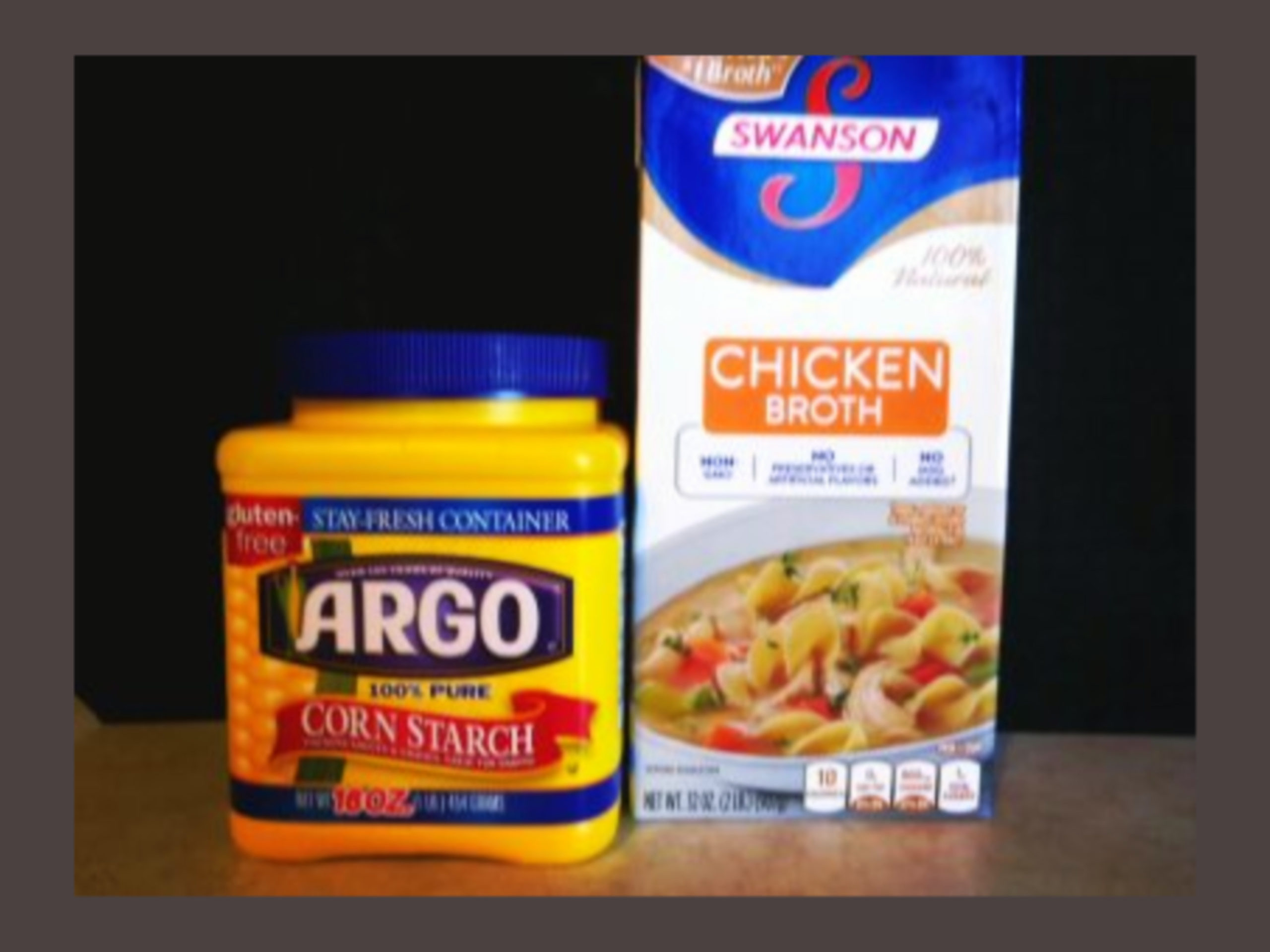 A container of corn starch and chicken broth.