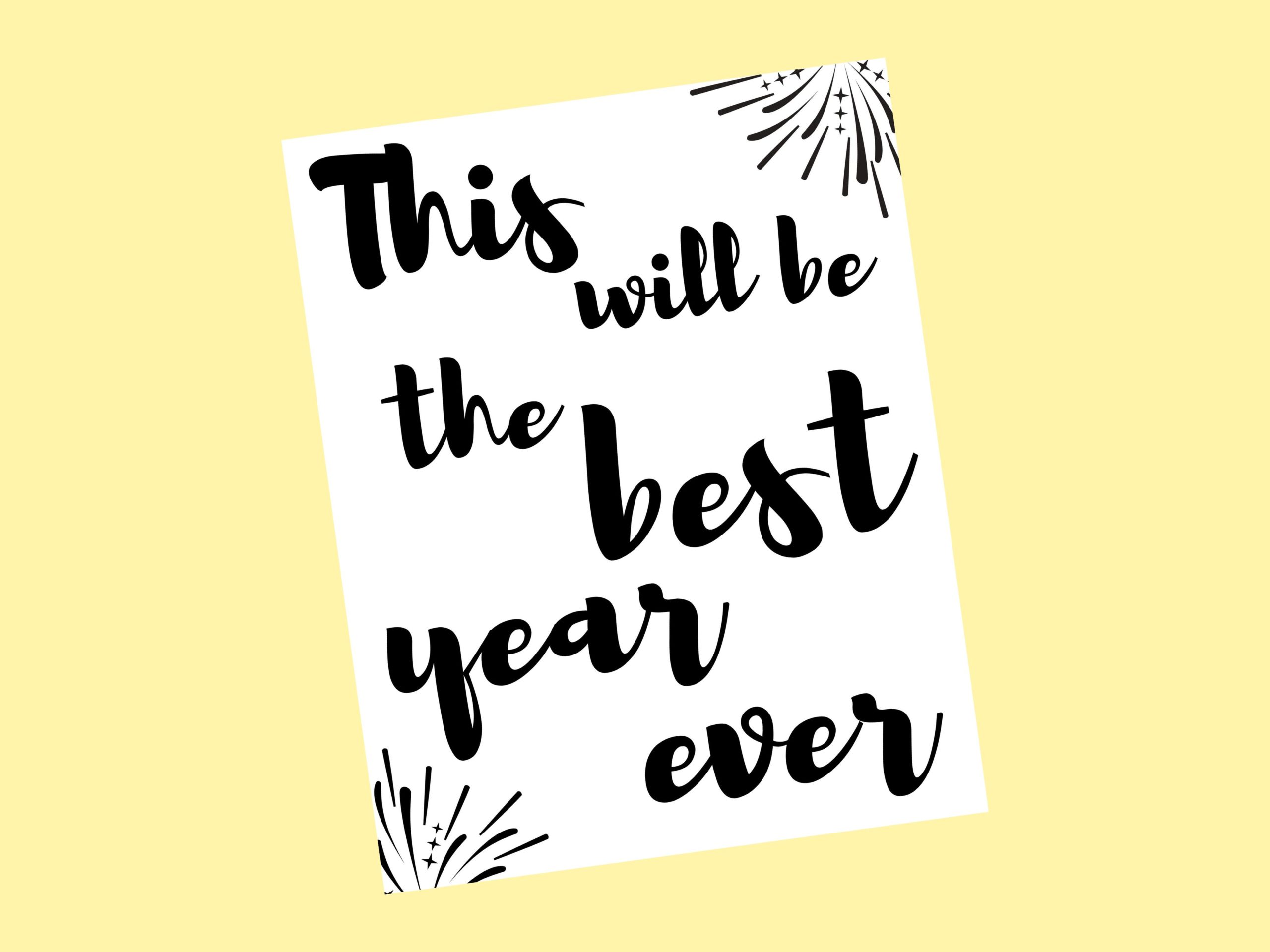 A white 8" x 10" printable that says, "This will be the best year ever" in black, bold, script letters with two black fireworks exploding in the corners.