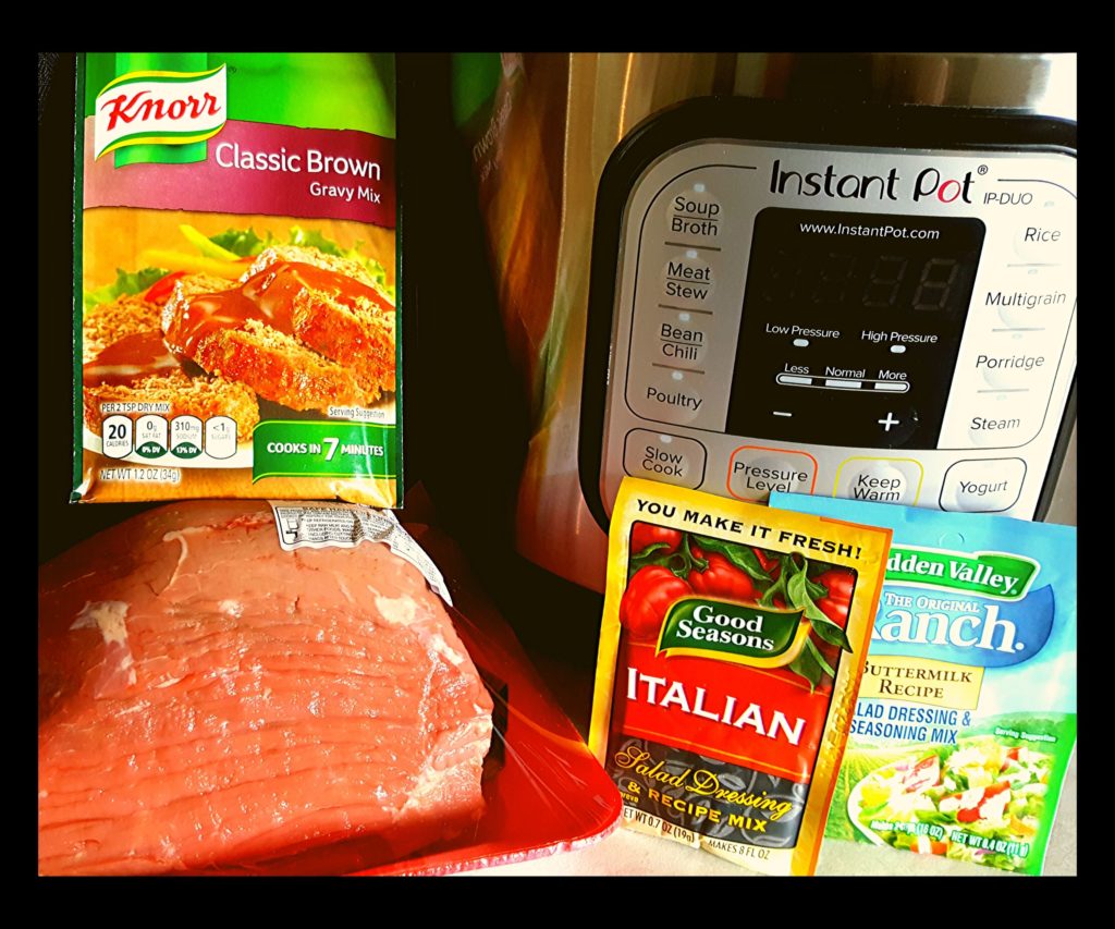 A Instant Pot, uncooked beef roast, dry ranch packet, brown gravy packet, and dry italian dressing.