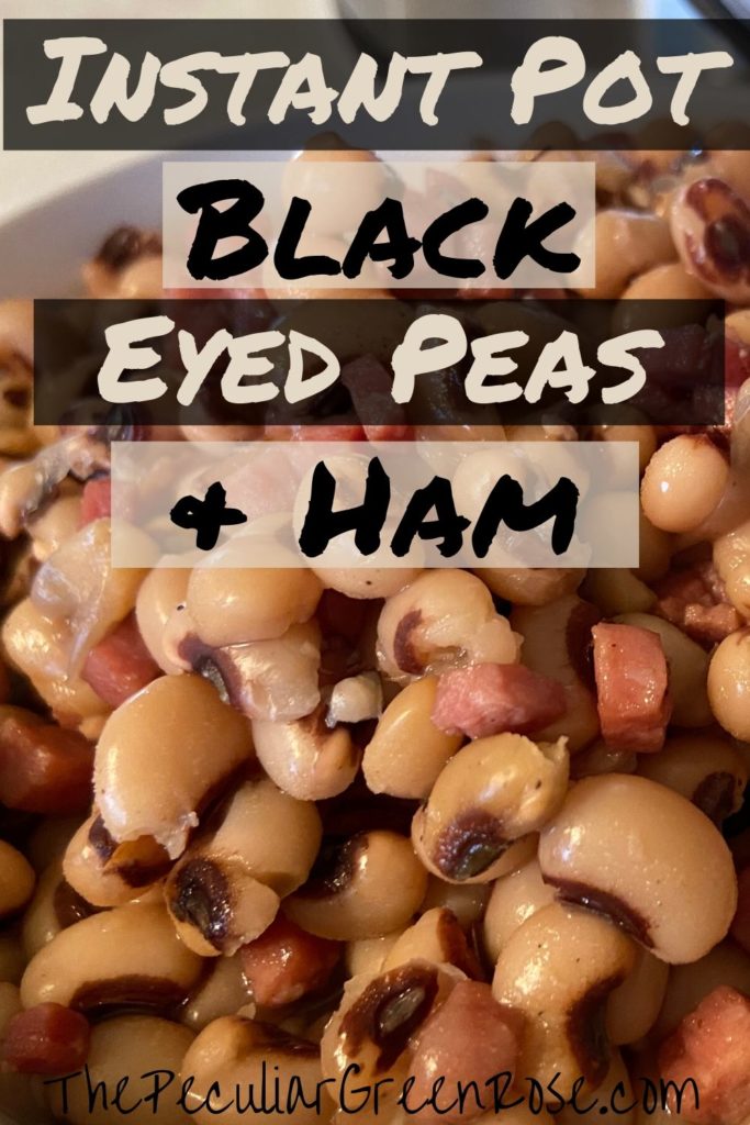 A white bowl filled with black eyed peas and chunks of ham.