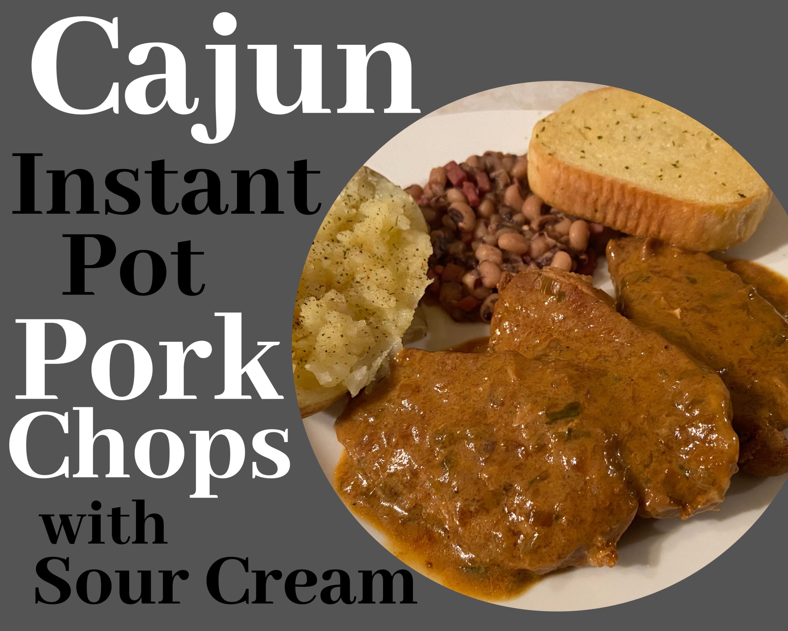 A white plate with cajun instant pot pork chops covered with gravy next to baked potatoe, black eye peas and garlic bread.