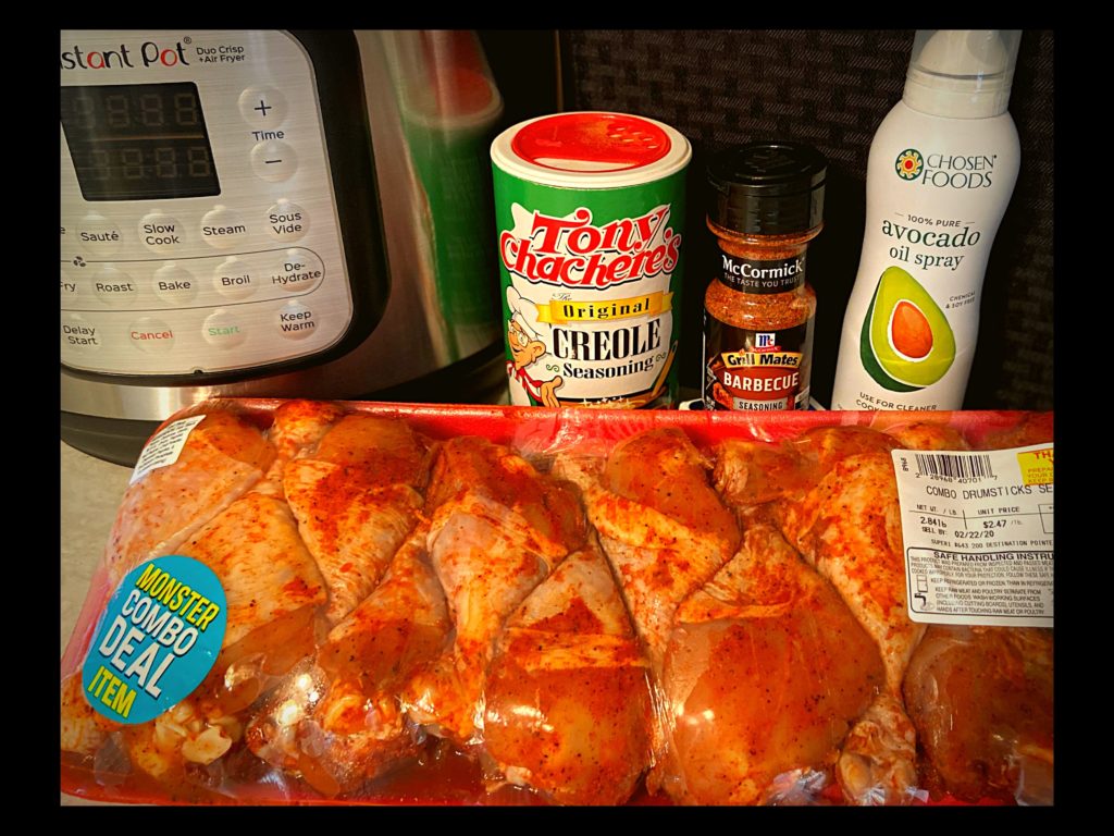 An Instant Pot, Tony Chachere's Seasoning, McCormick BBQ Seasoning, Avocado Oil Spray, and BBQ Chicken Drumsticks.