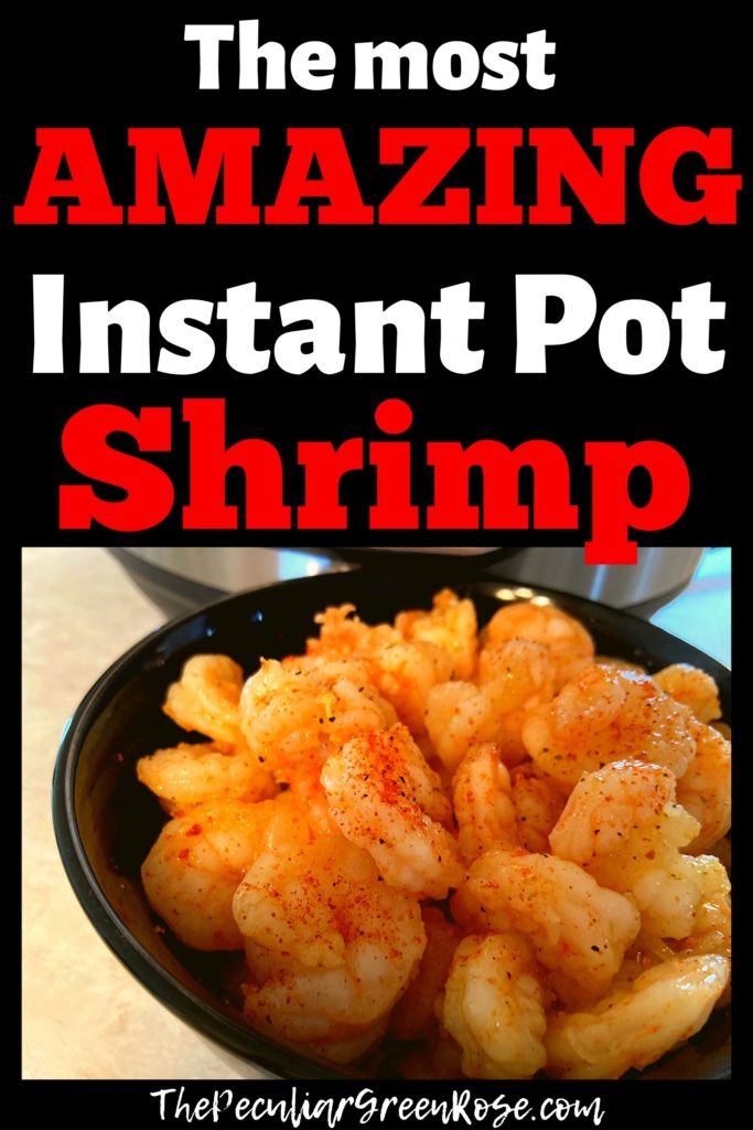 A black bowl filled with cooked shrimp sitting on a counter top in front of an Instant Pot.