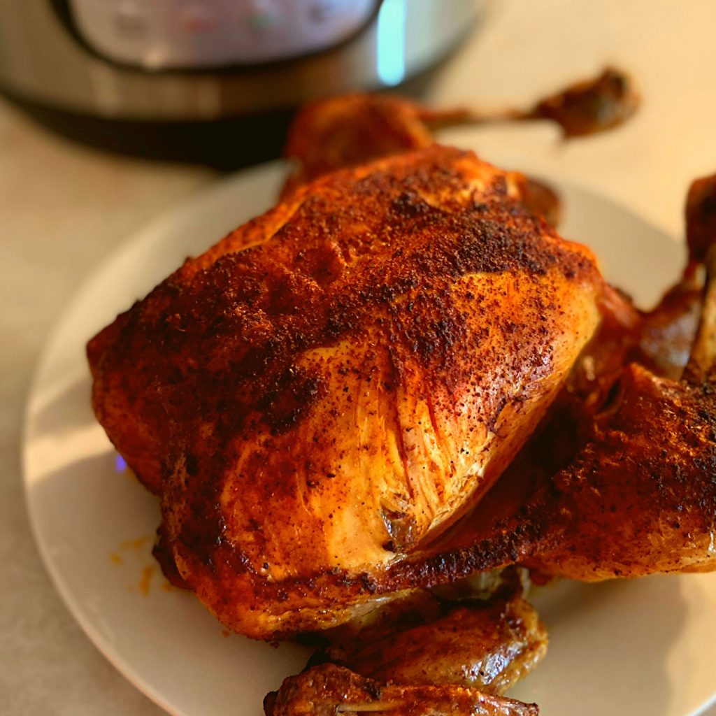 Instant Pot Whole Chicken and a Instant Pot Duo Crisp on a kitchen counter