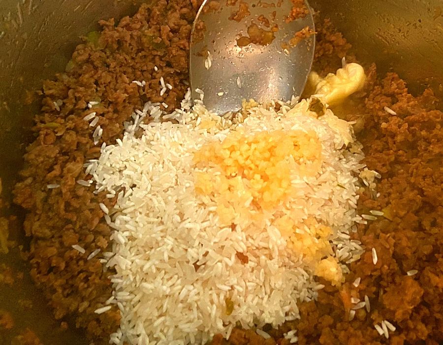 Ground Beef, ground pork, uncooked long grain rice, minced garlic, and butter in an Instant Pot