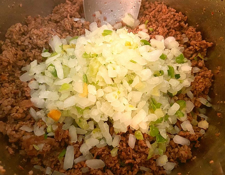 Ground beef, ground pork, onions, and bell peppers in an Instant Pot