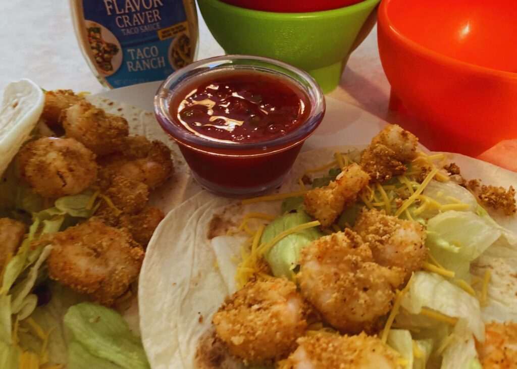 Shrimp tacos on a kitchen counter with a Instant Pot