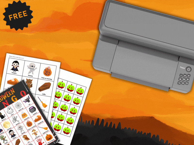 Illustration of a printer printing colorful Free Halloween Bingo Cards against an orange sunset background. The printed sheets feature Halloween-themed icons like ghosts, pumpkins, bats, witches, and candy corn. Additional printed bingo sheets with cute Halloween graphics, including vampires, mummies, and jack-o’-lanterns, are laid out beside the printer. A black starburst label on the top left corner reads “FREE.”